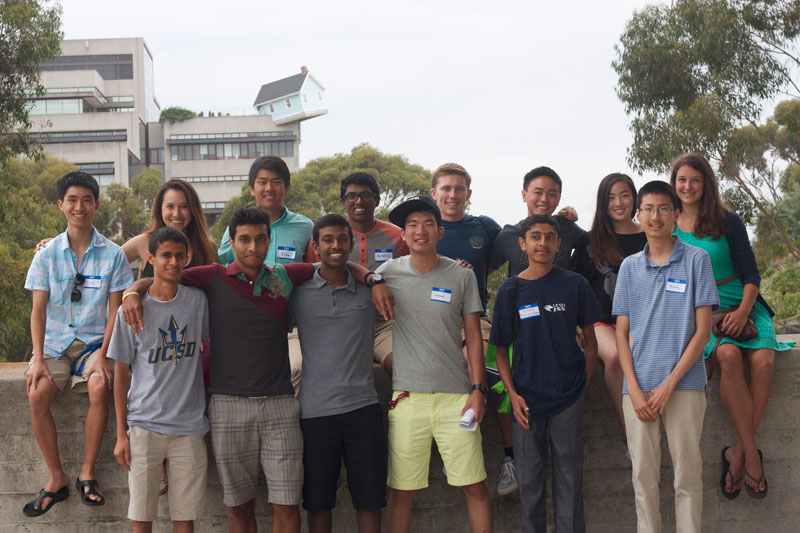 Students standing near Geisel Library with Engineering Building in background