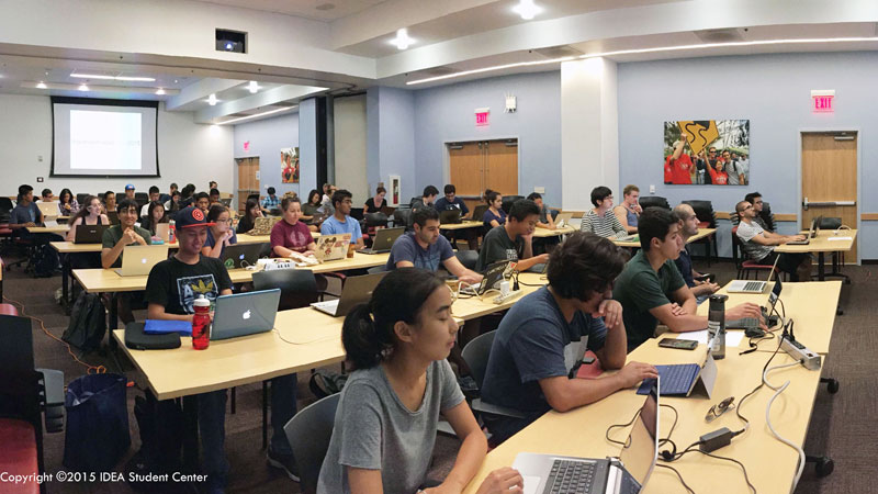 Students sitting in rows of tables